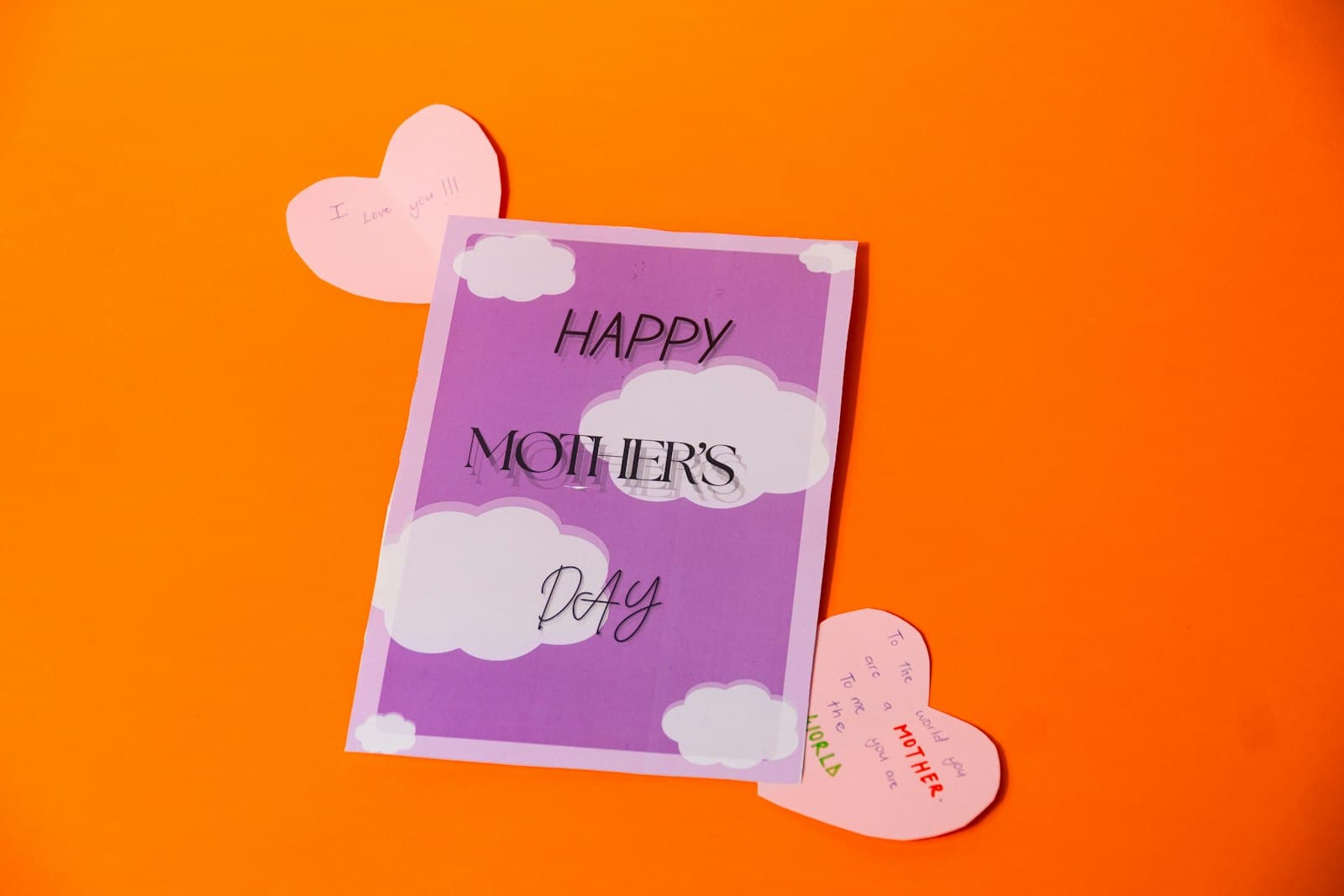 Handmade Mother's Day card with hearts on a bright background